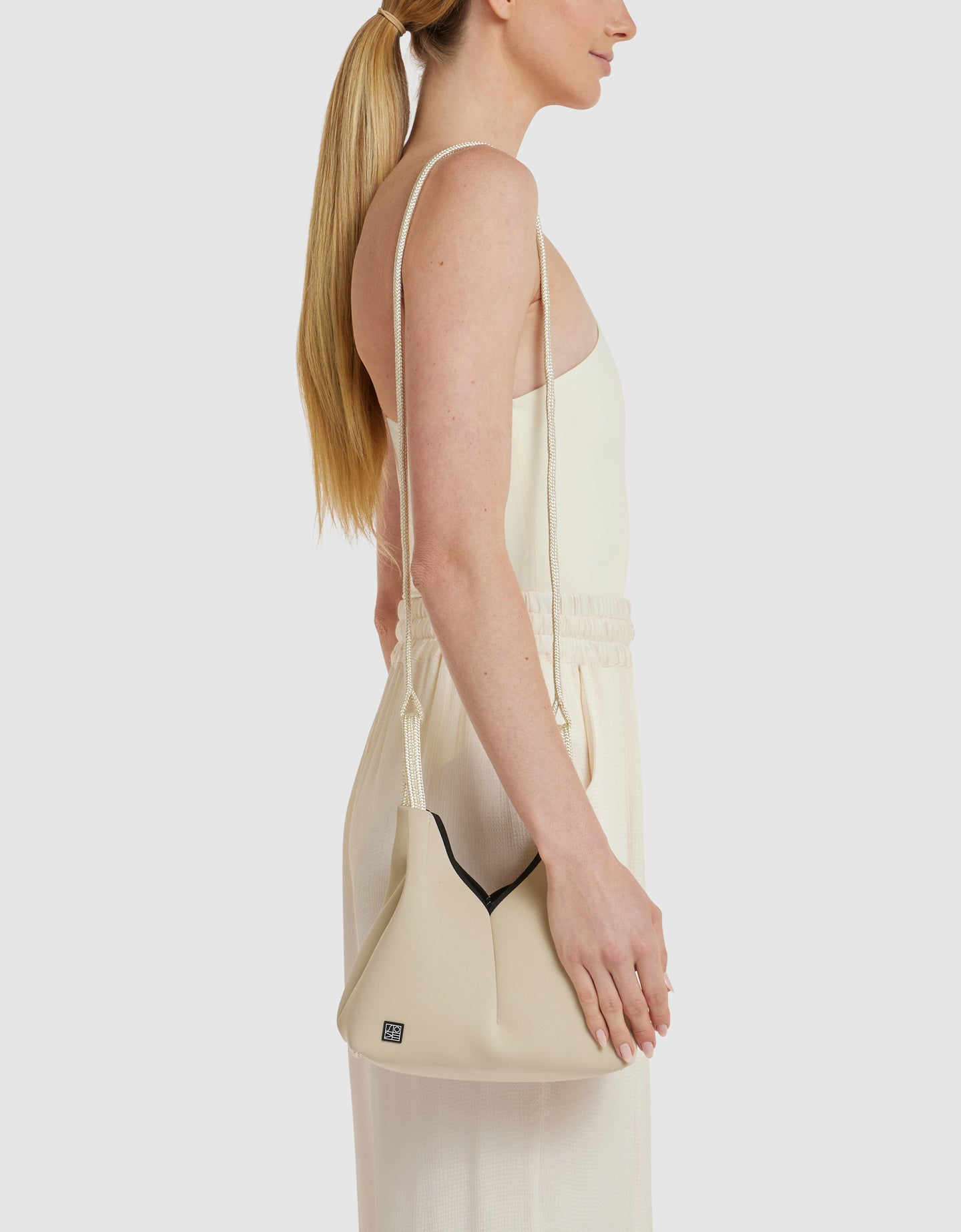 Bondi Born x State of Escape Solstice crossbody in soft gold